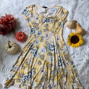 Yellow dress with blue and white flowers.